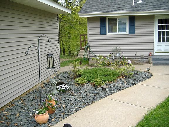Beautiful Gardens Throughout Yard, 2 Car Garage Close to Front Door