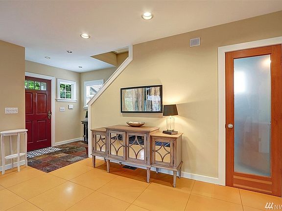 Slated entry way with powder room located conveniently on main floor.