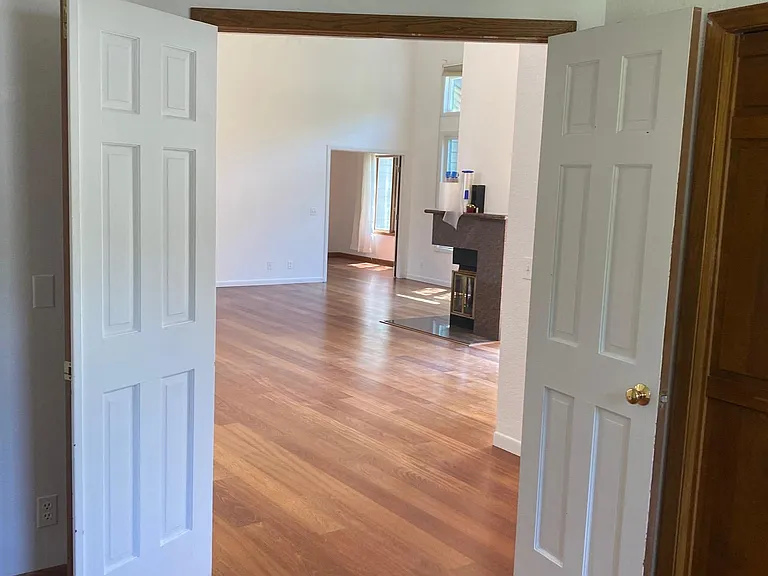Office or third bedroom has french doors with view onto the living room.