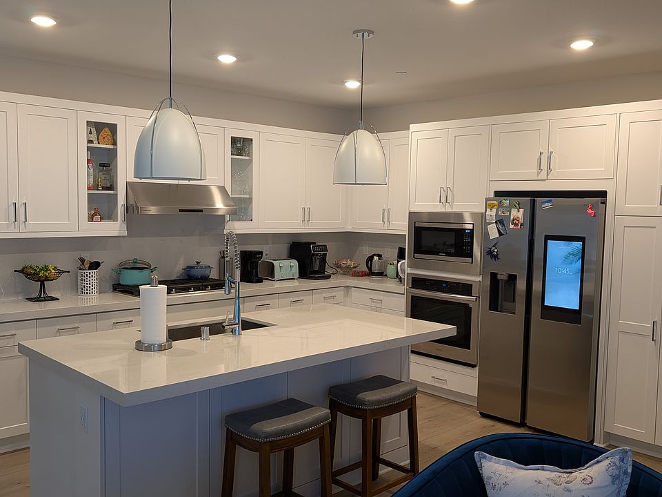 Kitchen with Island. Stainless Steel Samsung Appliances.