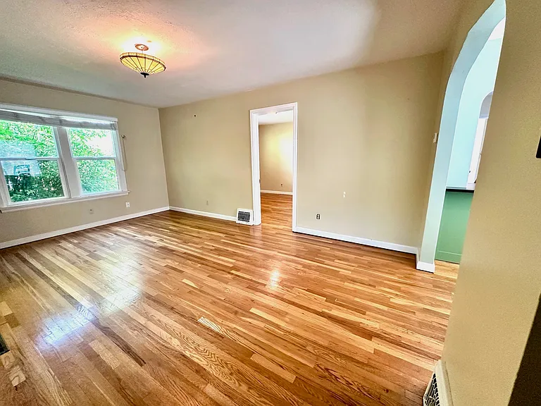 Front room with large windows and natural light