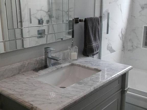 Stylish vanity, mirror in the newly renovated bathroom.