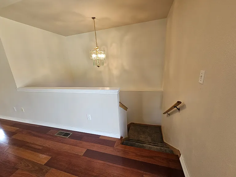 Staircase leading to lower level of home.