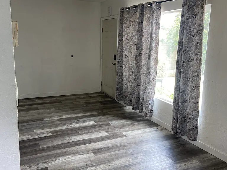 Living room with large front window providing lots of light