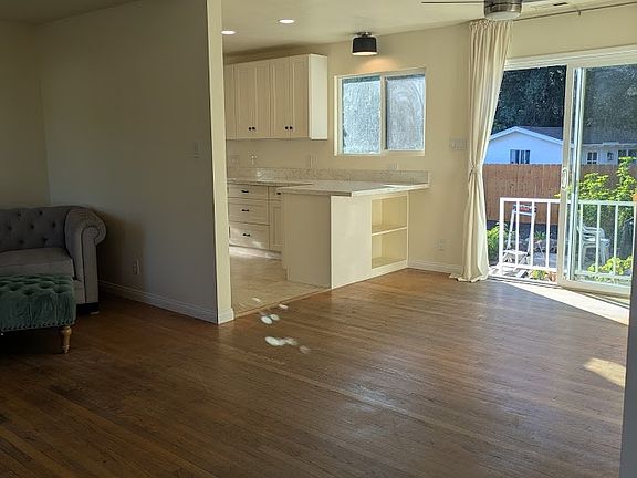 Kitchen bar and dining area. Great view out of the private back yard.
