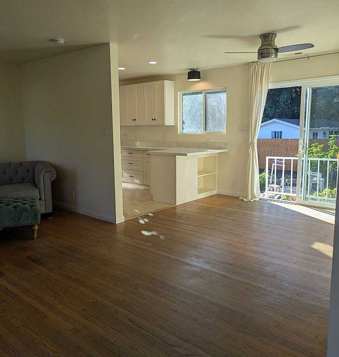 Kitchen bar and dining area. Great view out of the private back yard.
