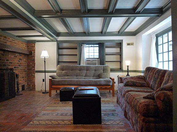 beamed living room with fireplace