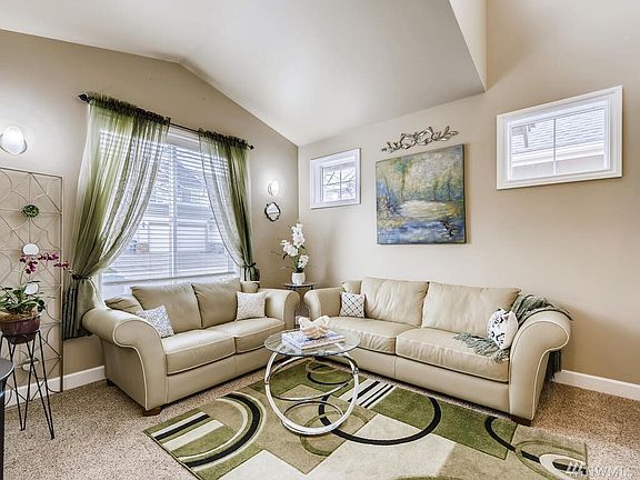 Comfortable front living room, vaulted ceilings and lots of natural light, feels so spacious.