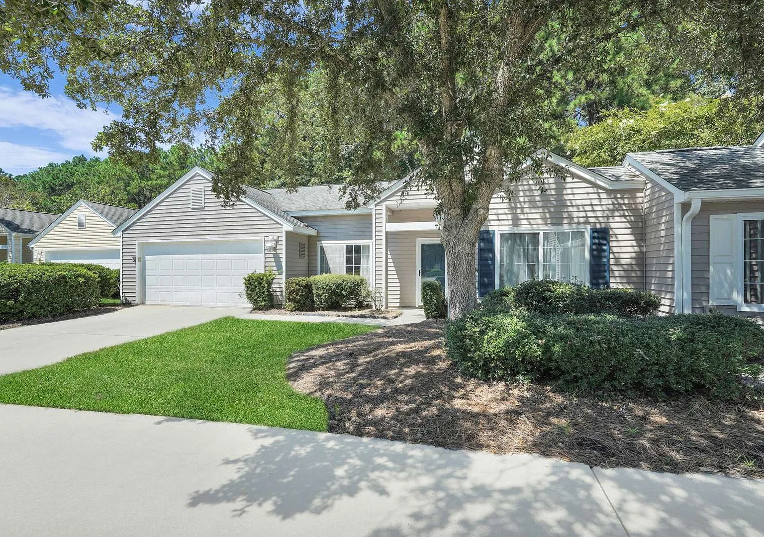 "Charming 2-Bed Oasis with 2 Full Baths, Den and Screened Patio on Huquenin Lane in Sun City!" — Photo 2