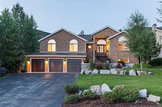 Welcome home! This residence features a maintenance free brick exterior & large 3 car garage