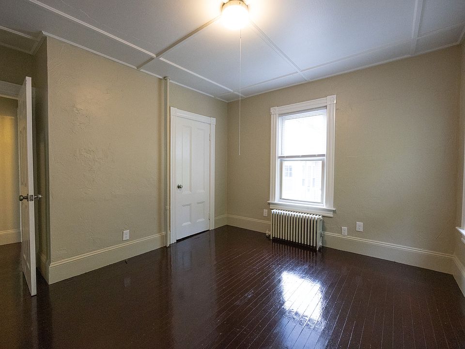 Bedroom with natural light and hardwood floors