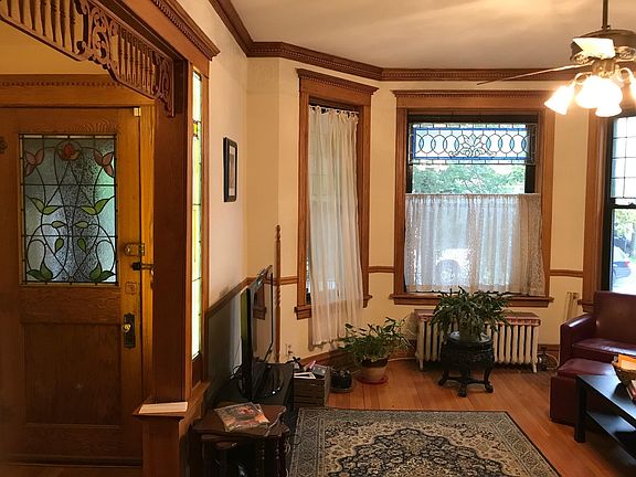 Front room with lighted entry hall and stained glass.