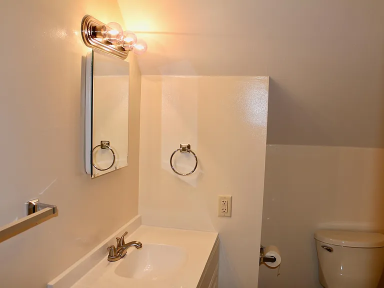 Bathroom with new vanity and fixtures.