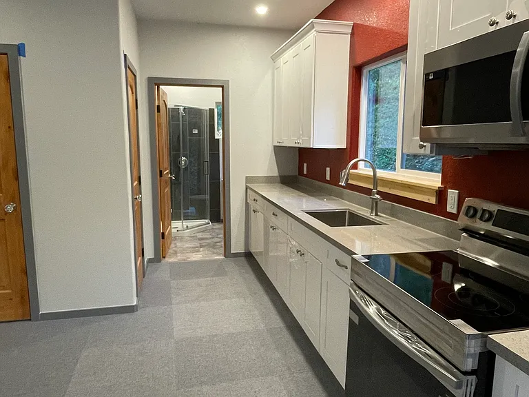 Kitchen leading to bathroom