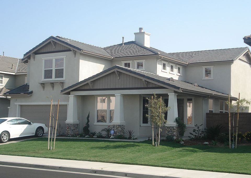 Five bedroom Home w/family room and backyard patio, 3 car tandem garage...