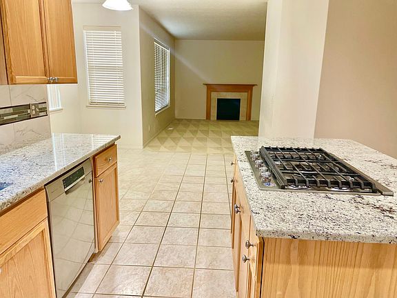 spacious kitchen looking on to living room
