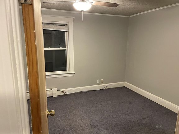 This photo is taken from the doorway from the living room peaking into the bedroom.