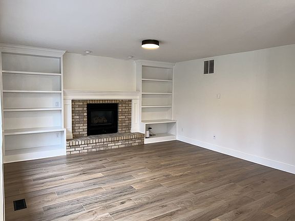 Living room. Gas fireplace. New flooring and paint.