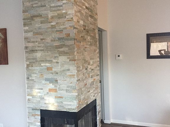 Gas fireplace with stone