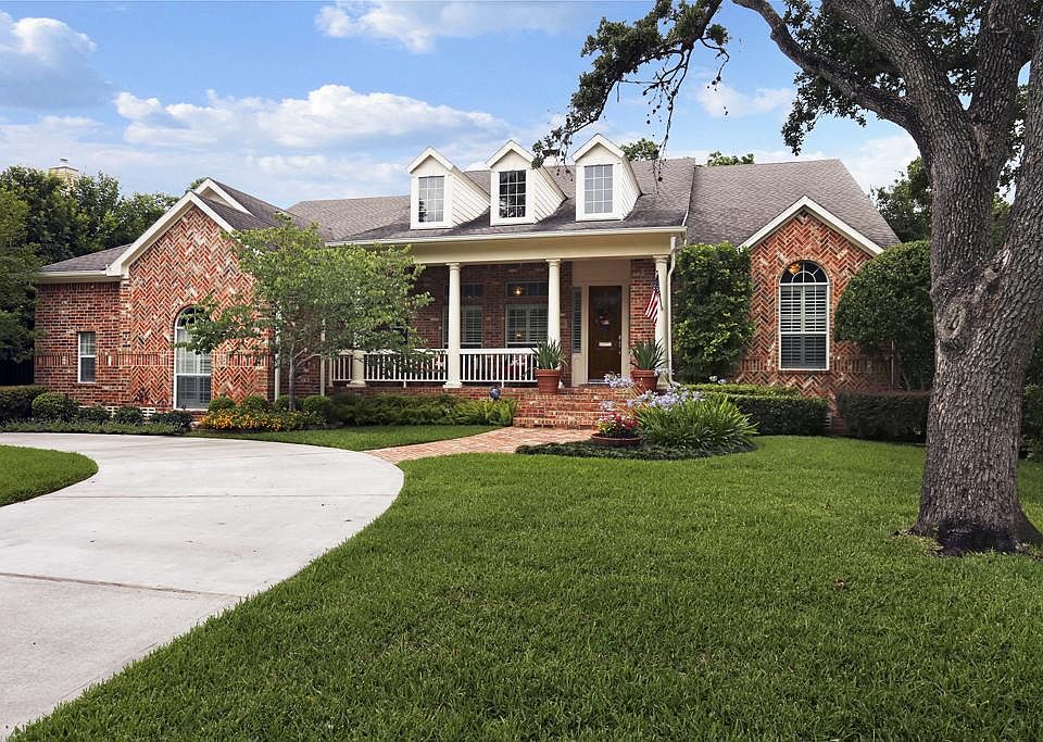 Talk about curb appeal! This home has it covered, From the approach of the circular drive, to the wi