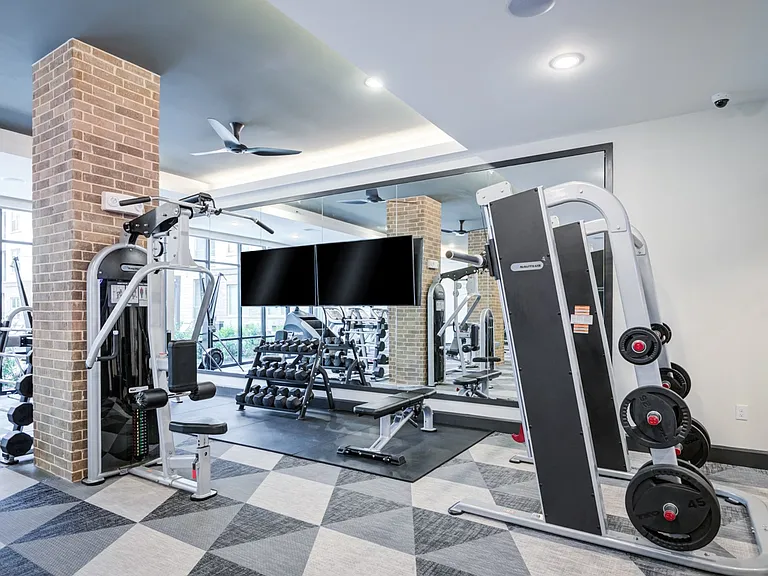 Fitness Center Featuring Weight Machines and Free Weights