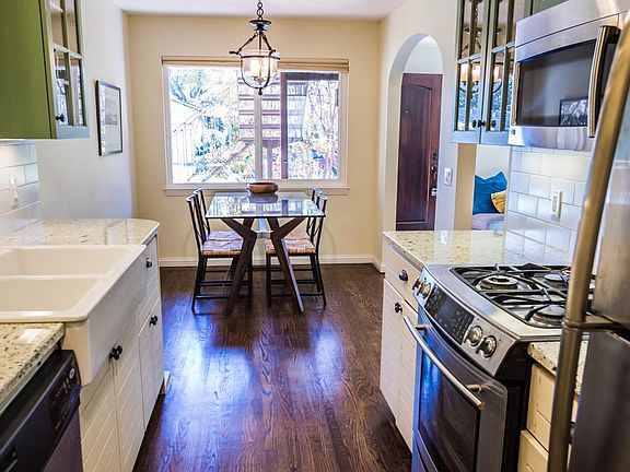 Kitchen with stainless steel appliances and hardwood floors