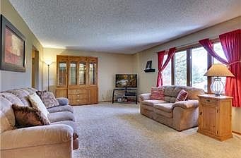 Relaxing living room has great southern views out the over-s