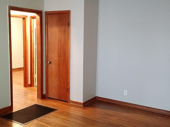 Main room, bedrooms and bathroom to left, kitchen to right.