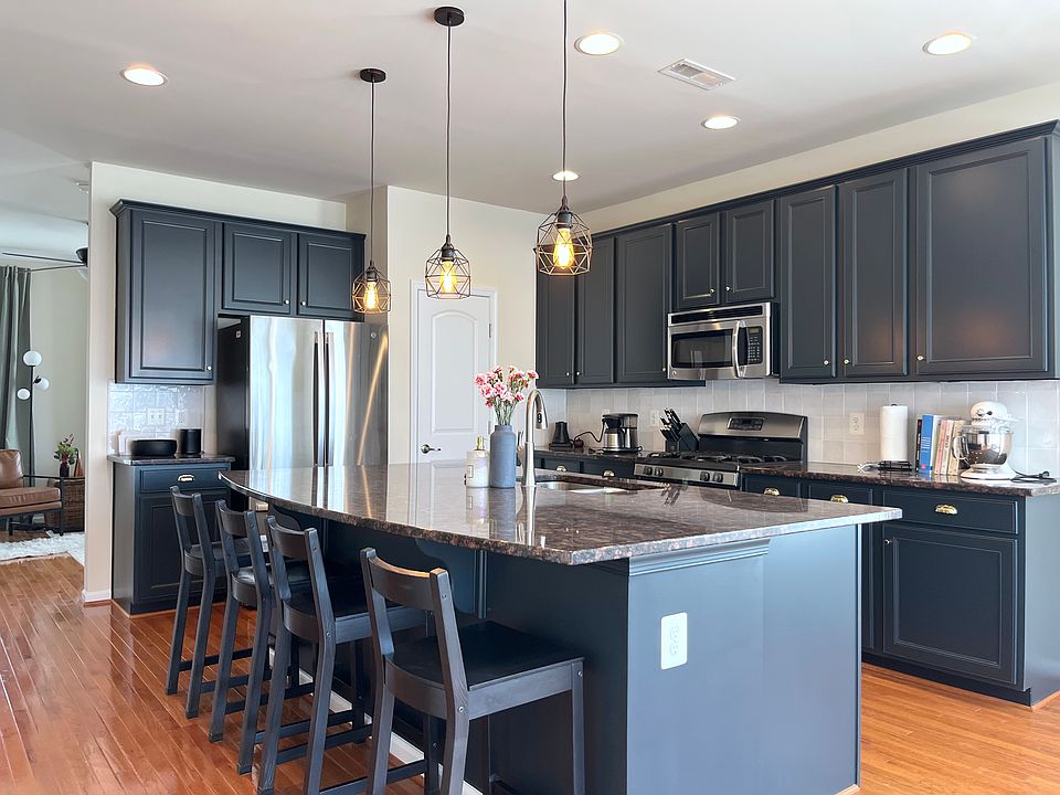 Updated kitchen (2025) with gas stove & large island, perfect for entertaining.