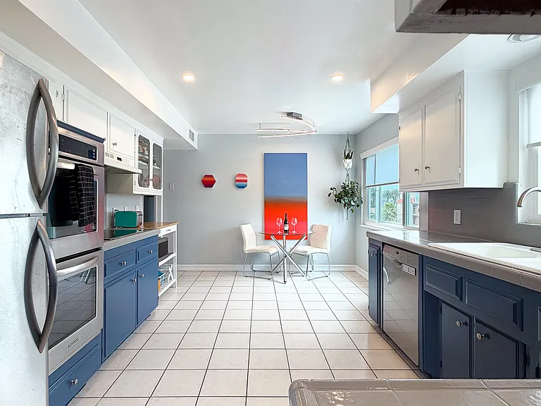 Bright, spacious kitchen with breakfast nook and generous storage.