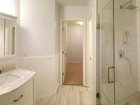 Light and bright master bathroom. Large walk-in closet, and 