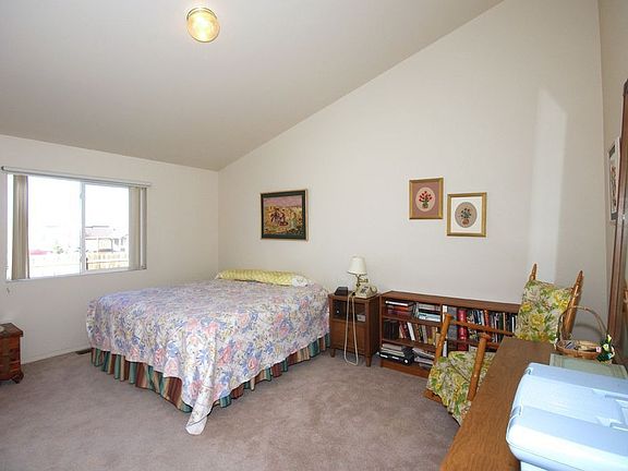 Master bedroom has an adjoining bath, vaulted ceiling, walk-in closet