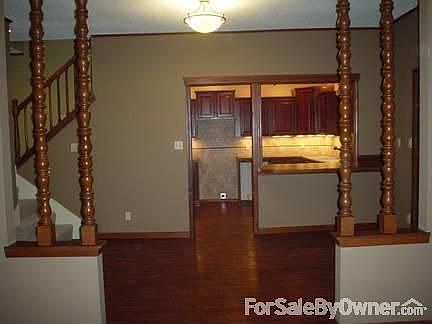 View from living room looking into dining room and kitchen.
