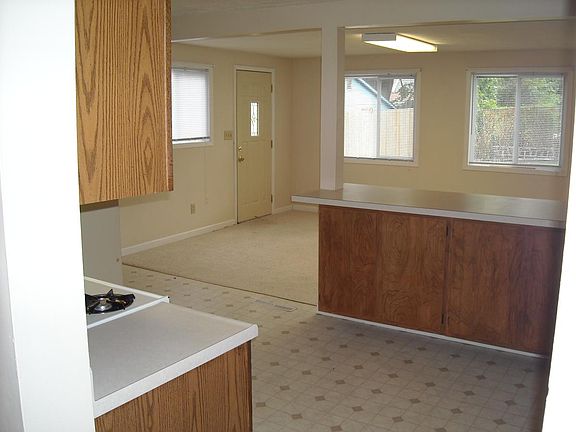 View back to Dining area before new flooring in both rooms