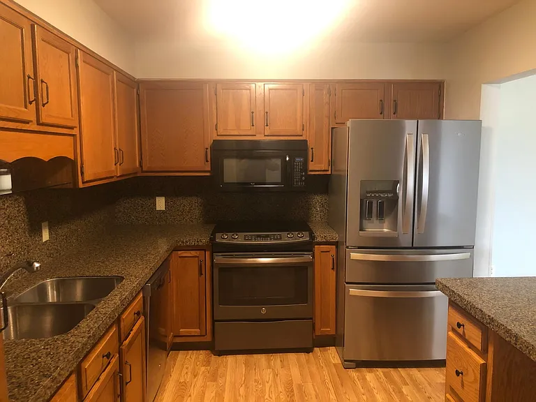 Updated stainless steel appliances and plenty of cabinet space