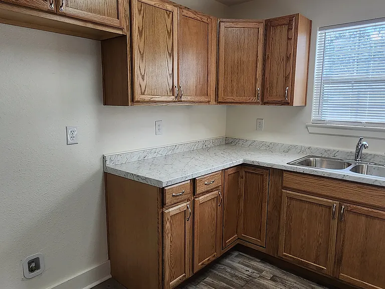 Kitchen - new oak cabinets, new counters, stainless steel sink.