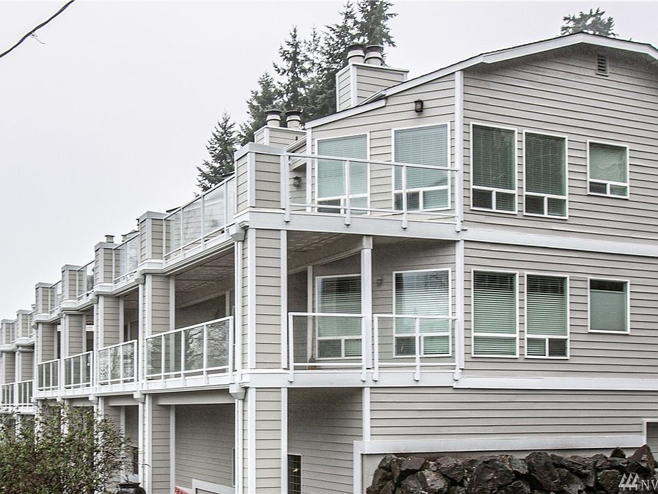 Welcome home to Bay Vista Estates! This is a 12 home community located just steps from Juanita Beach Park! On clear days you can get peek-a-boo views of Lake Washington from your private terrace! There are three levels: Garage (secured), 1st level and top level. Unit 9 is 2nd from the end on the first level and features a ~300sf covered terrace living space that you can enjoy all year/any weather!
