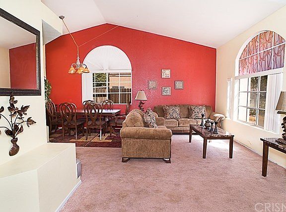 Open floor plan concept, with combination of dining room and living room and high ceilings