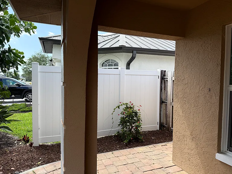Front entrance view of side gate to back yard