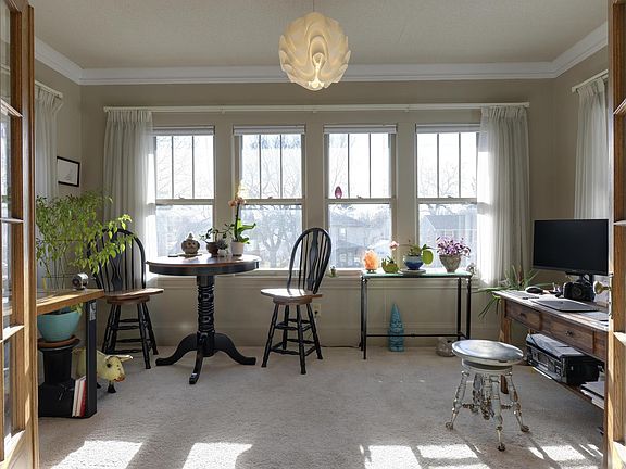 Bonus front sunroom with french doors