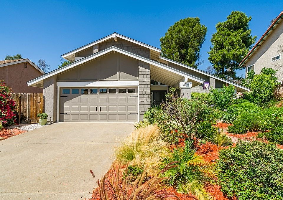 Awesome curb appeal being freshly painted with rose garden & well-manicured front landscaping