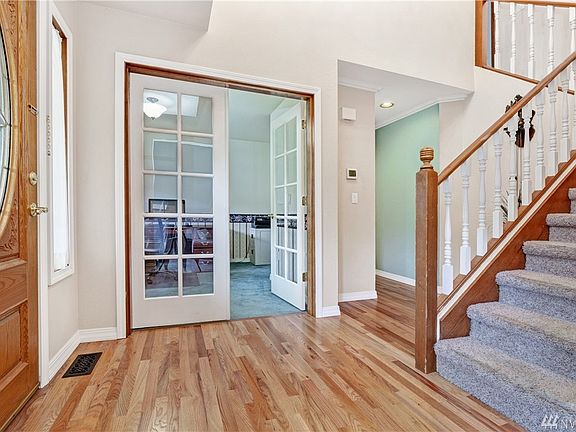 Office off the entry has French doors
