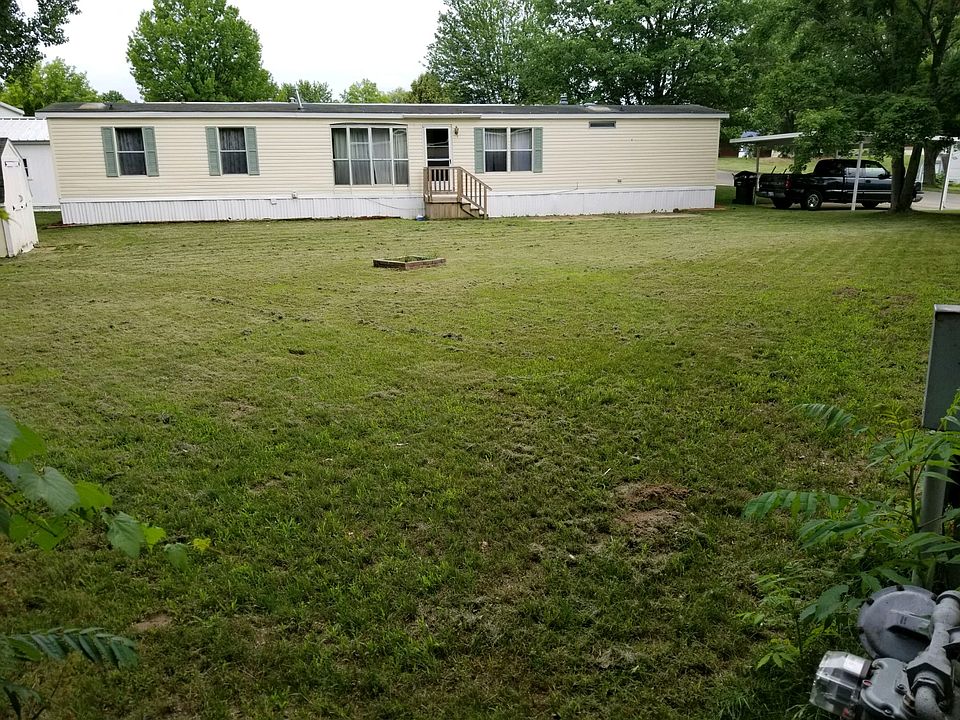 Side view of home. Huge lot!