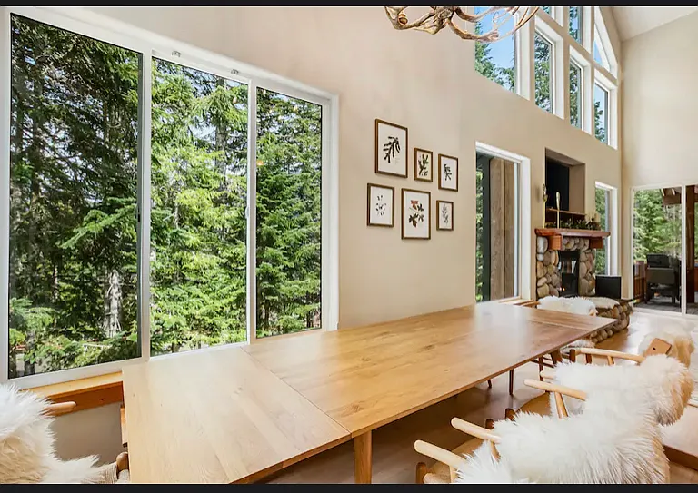 large dining area with high vaulted ceilings