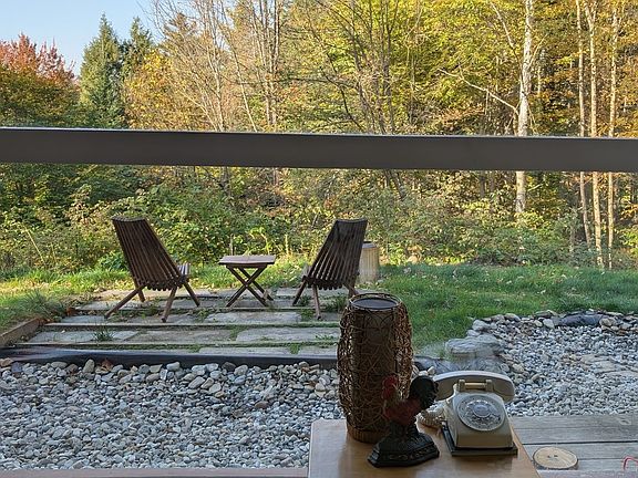 View from the living room's wall of windows. Yes, there are insulated mini blinds!