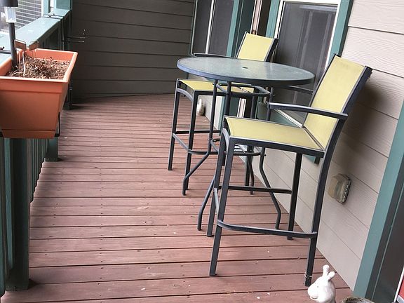 Balcony with two doors into condo unit