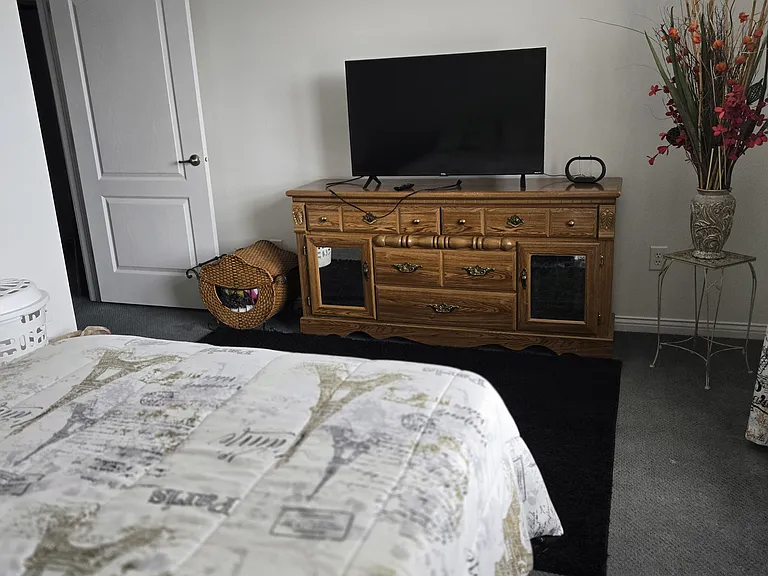 Bedroom 4: Full bed, dresser, wide closet, area rug, remote-controlled ceiling fan, curtains.