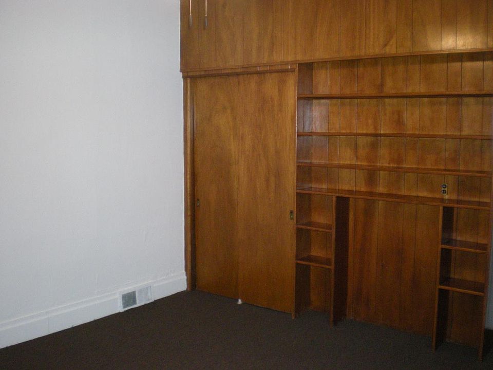 Bedroom with storage/closet wall