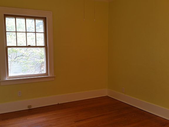 Master bedroom - Large square room with large windows on 2 walls.