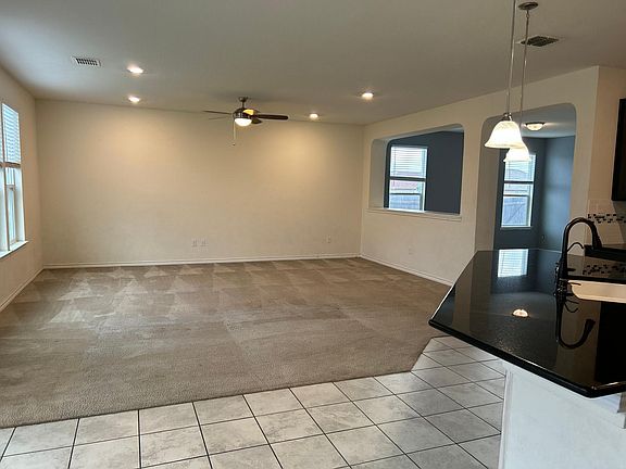 Family room with with archway into dining room